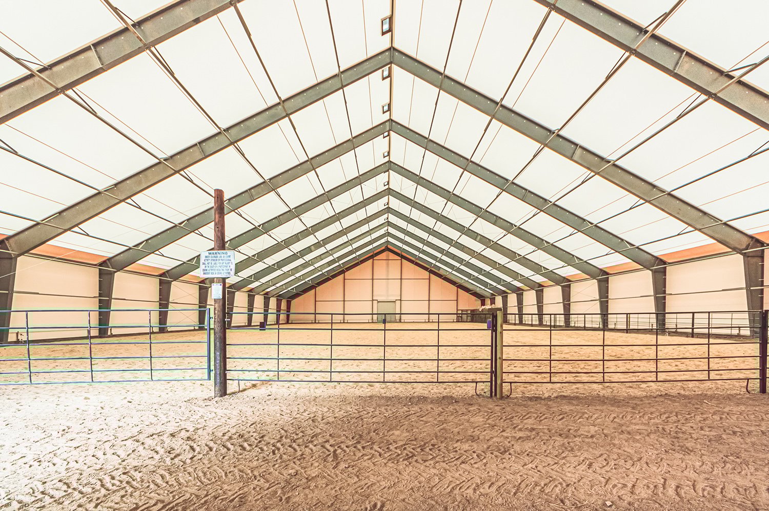 Horse barns with indoor riding arena