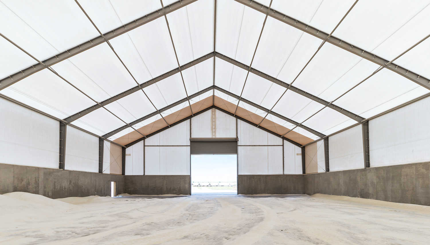 Tension fabric structure vs. monocover fabric buildings