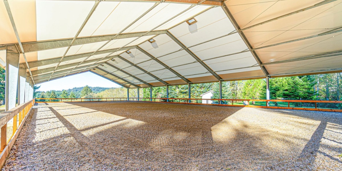 Steel I-beams in an equestrian fabric riding arena