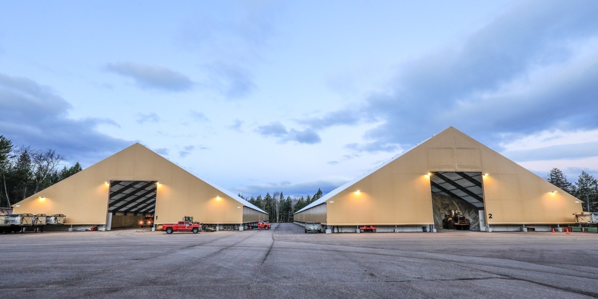 Two tension fabric salt storage buildings